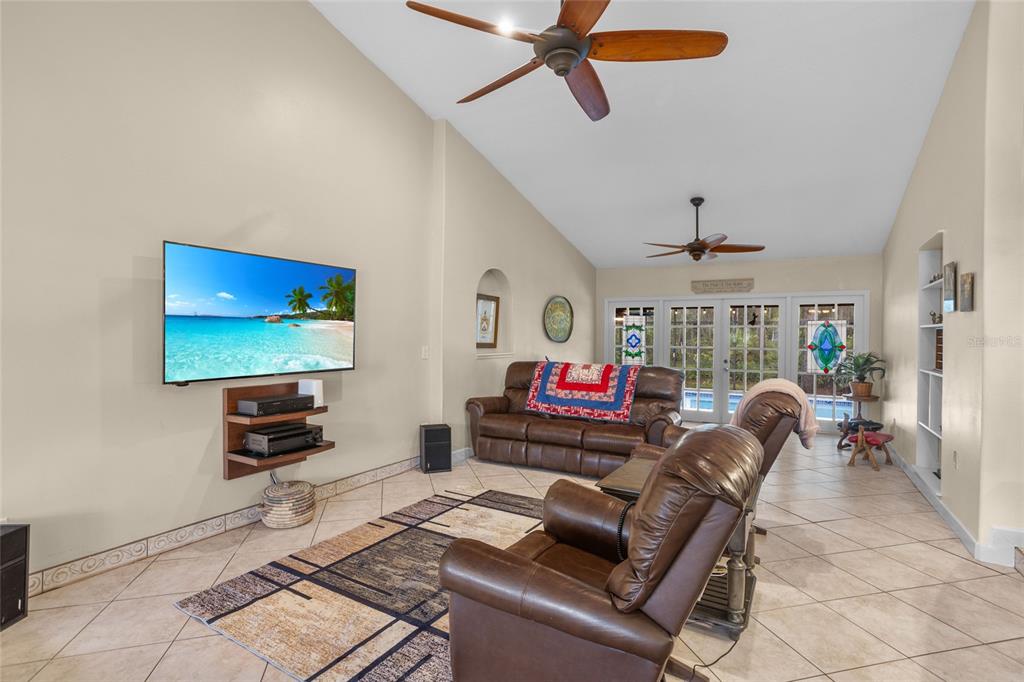 14612 Bray Road Orlando, FL 32832 - Photo 12 of 33 a living room with furniture and a flat screen tv