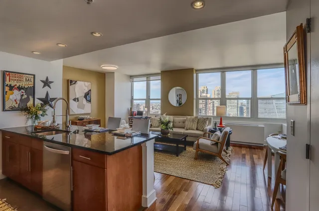 a living room with furniture and a large window
