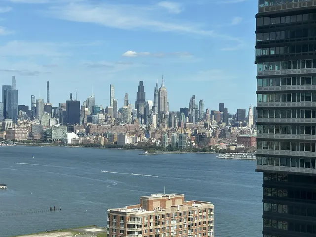 a view of a city with tall buildings