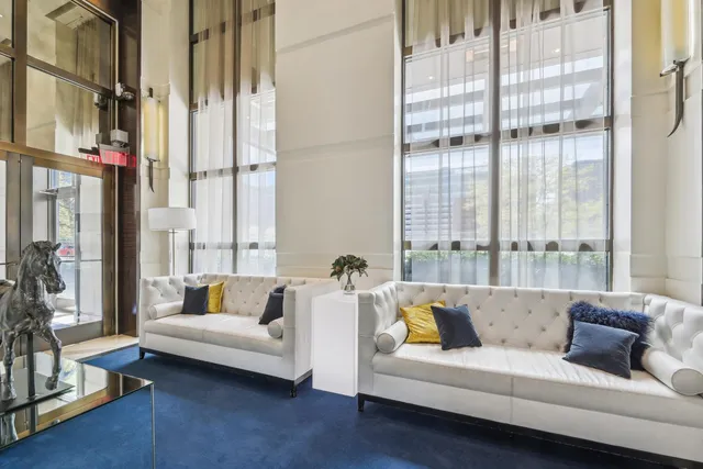 a room with stainless steel appliances kitchen island granite countertop cabinets and wooden floor