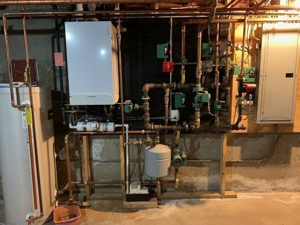 43 West Street Beverly, MA 01915 - Photo 15 of 15 a room with lots of bottles of alcohol