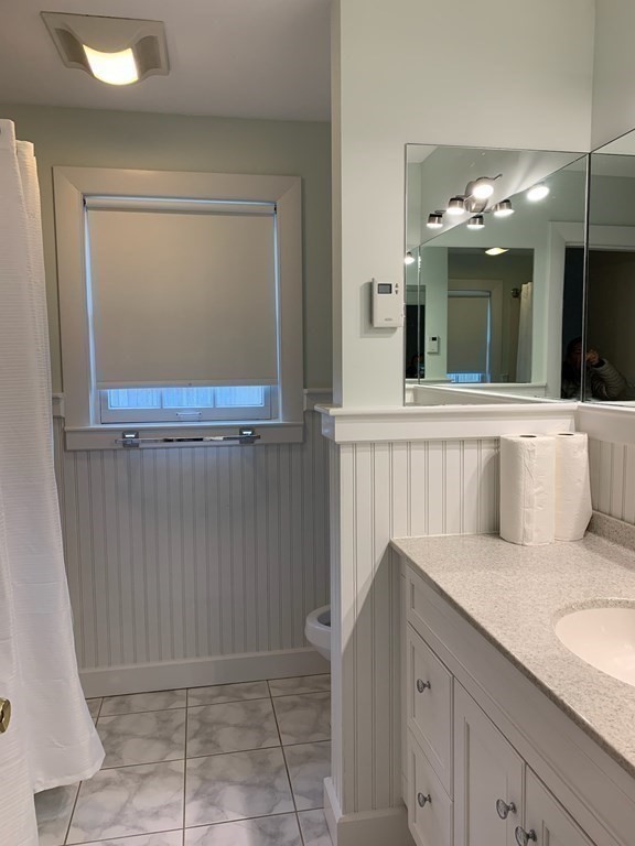 43 West Street Beverly, MA 01915 - Photo 9 of 15 a view of a bathroom with a sink and mirror