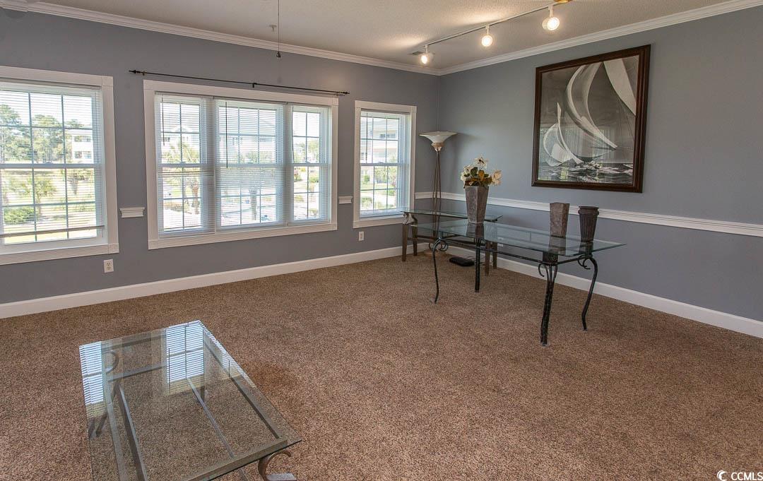 4823 Orchid Way, Unit 2203 Myrtle Beach, SC 29577 - Photo 11 of 36 Home office with a wealth of natural light, ornamental molding, and carpet flooring
