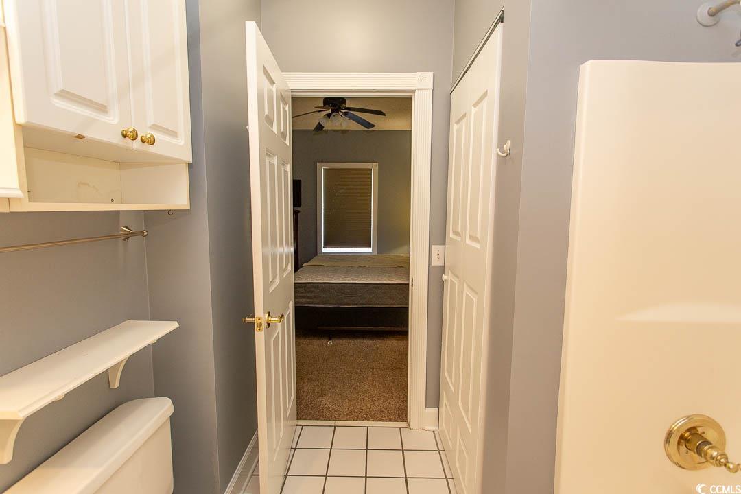 4823 Orchid Way, Unit 2203 Myrtle Beach, SC 29577 - Photo 18 of 36 Bathroom featuring tile patterned floors, baseboards, a ceiling fan, and toilet