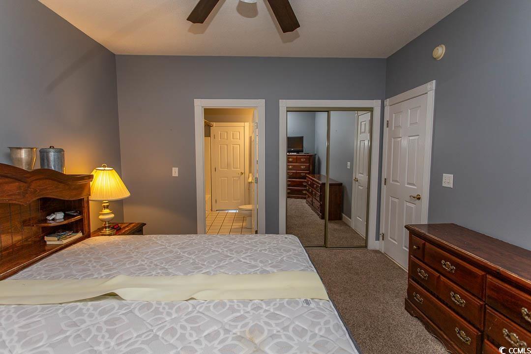 4823 Orchid Way, Unit 2203 Myrtle Beach, SC 29577 - Photo 23 of 36 Bedroom with carpet floors and ceiling fan