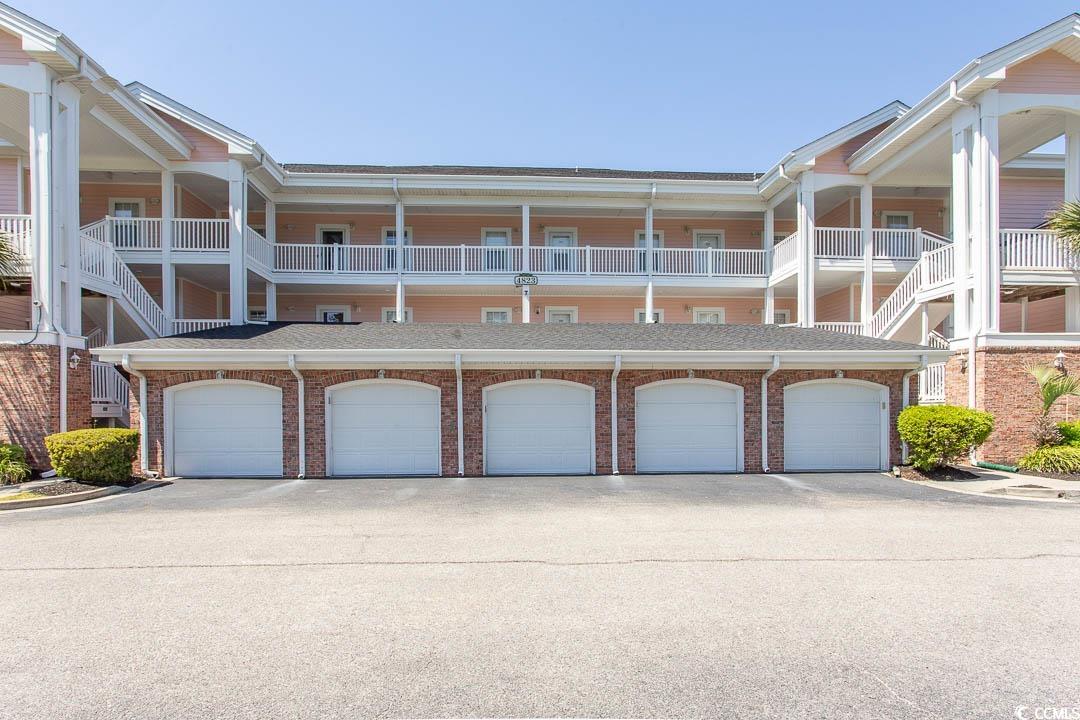 4823 Orchid Way, Unit 2203 Myrtle Beach, SC 29577 - Photo 27 of 36 View of front of property with community garages and brick siding