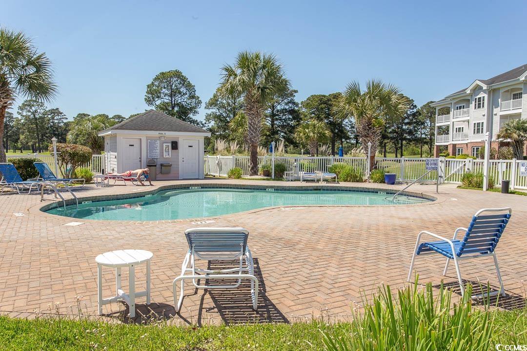 4823 Orchid Way, Unit 2203 Myrtle Beach, SC 29577 - Photo 34 of 36 Pool featuring fence and a patio