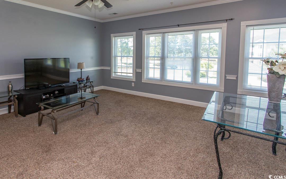 4823 Orchid Way, Unit 2203 Myrtle Beach, SC 29577 - Photo 9 of 36 Living area with a ceiling fan, baseboards, carpet floors, and ornamental molding