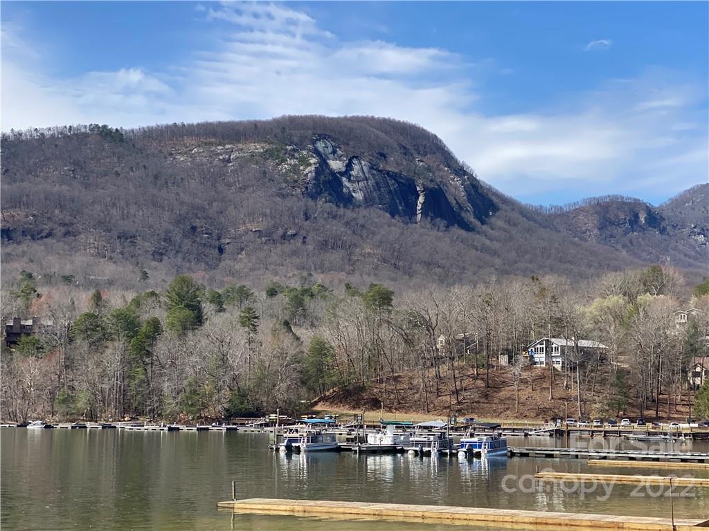 Tbd Rumbling Bald Road Lake Lure, NC 28746 - Photo 8 of 14 a view of a lake with a mountain