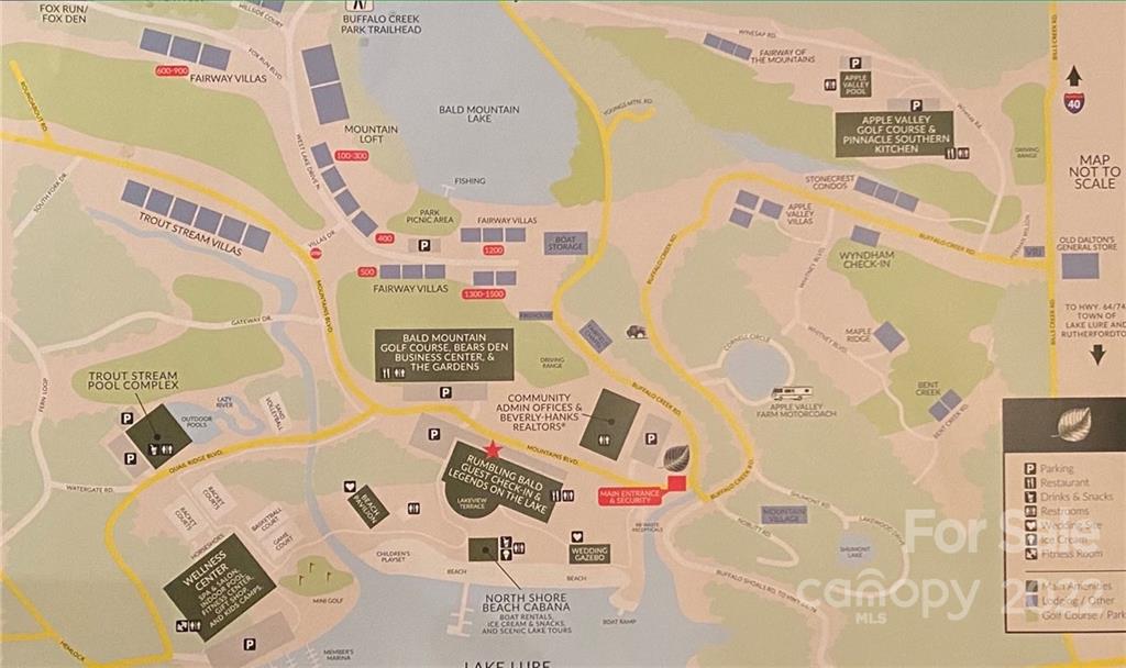 Tbd Rumbling Bald Road Lake Lure, NC 28746 - Photo 9 of 14 a bed with a white and a white comforter