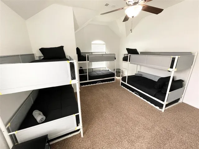 a view of living room with furniture and a ceiling fan