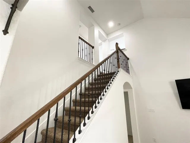 a bathroom with a sink mirror vanity and toilet
