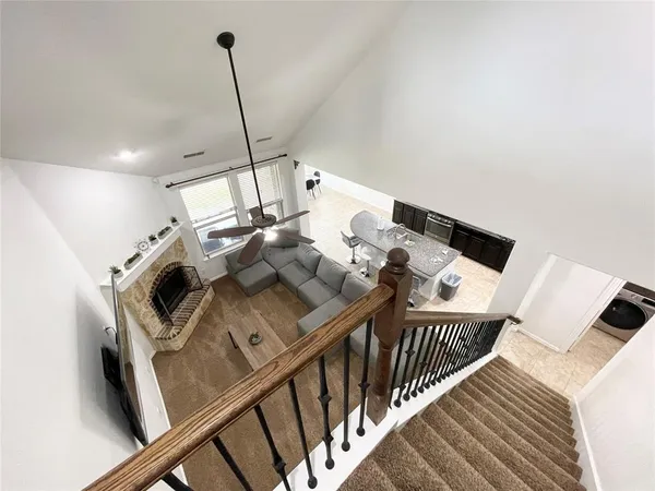 a view of a house with backyard porch and furniture