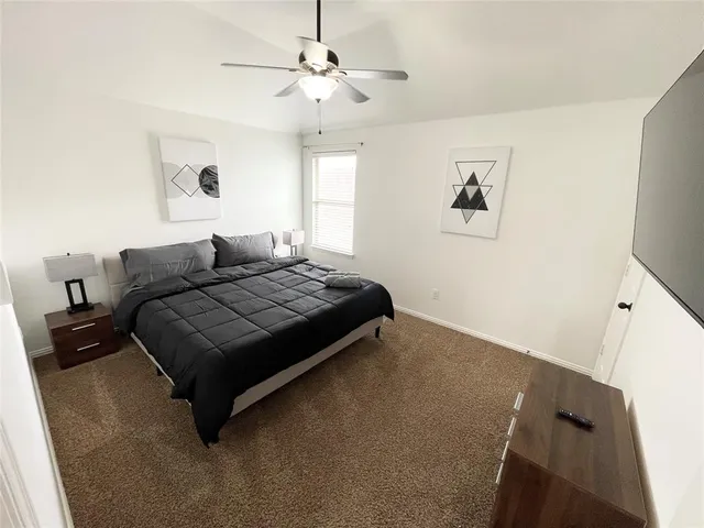 a bedroom with a bed and window