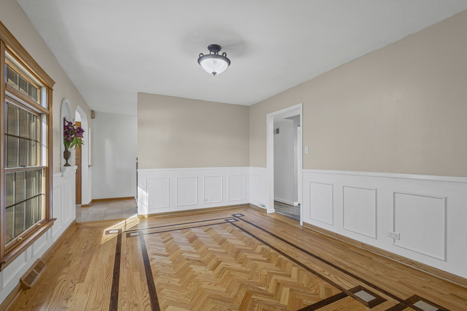 1323 South Roselle Road Schaumburg, IL 60193 - Photo 11 of 51 a view of an empty room with wooden floor