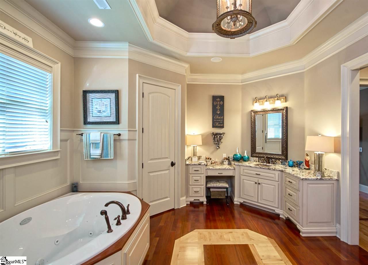 211 New Castle Drive Duncan, SC 29334 - Photo 13 of 36 Bronze sink with raised granite countertops with plenty of space for toiletries and jewelry. STUNNING ceilings, banded hardwood floors matching the design of the ceiling! Breathtaking!
