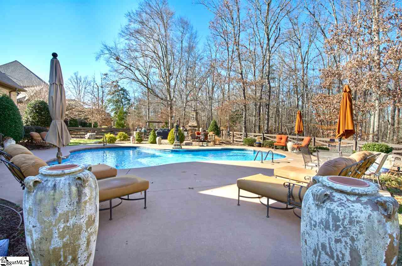 211 New Castle Drive Duncan, SC 29334 - Photo 28 of 36 Day or Night this has everything you need for family or friends. Stone Outdoor Fireplace with seating area and convenient to the stone outdoor kitchen area.. Sellers have had graduation parties and more with plenty of space for setting up tents too.