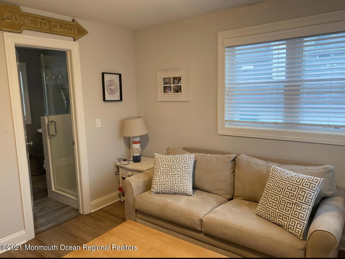 17 Via Ripa Way Sea Bright, NJ 07760 - Photo 17 of 33 a living room with a couch and a window