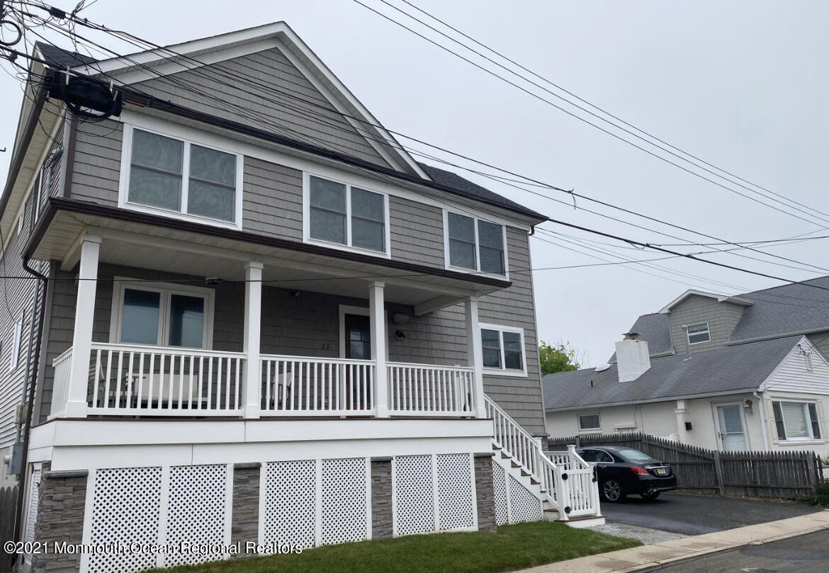 17 Via Ripa Way Sea Bright, NJ 07760 - Photo 18 of 33 a front view of a residential apartment building with a yard