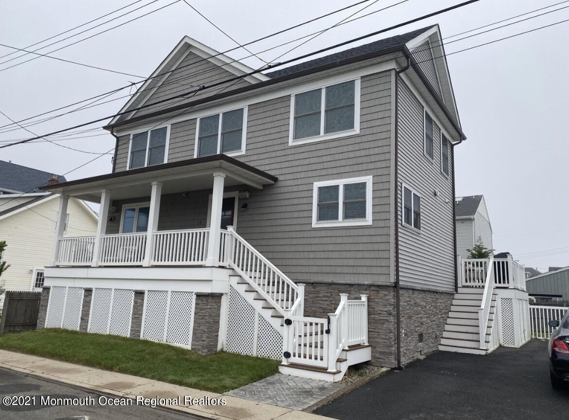 17 Via Ripa Way Sea Bright, NJ 07760 - Photo 19 of 33 a front view of a house with a yard