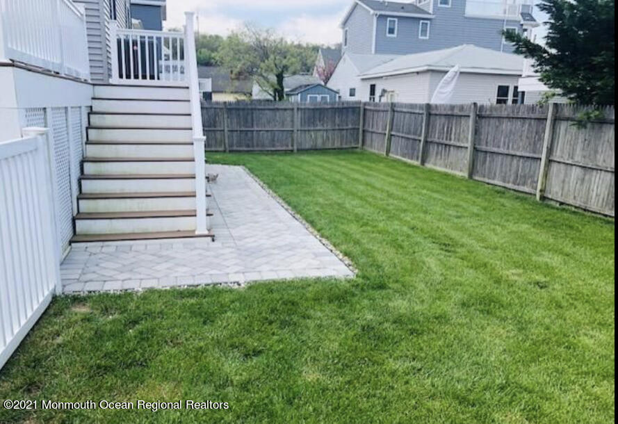 17 Via Ripa Way Sea Bright, NJ 07760 - Photo 23 of 33 a view of a backyard with a garden