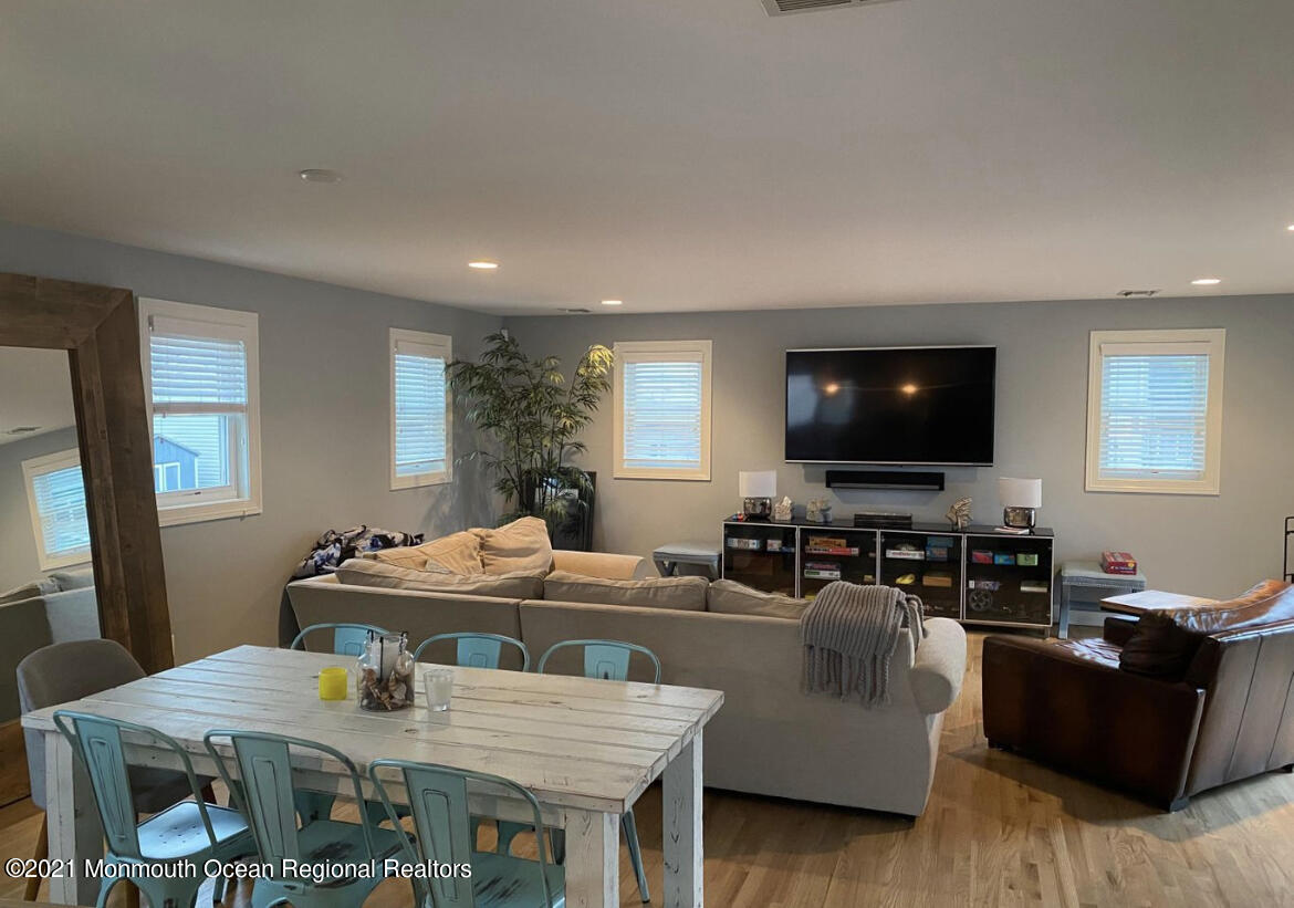 17 Via Ripa Way Sea Bright, NJ 07760 - Photo 3 of 33 a living room with furniture and a flat screen tv