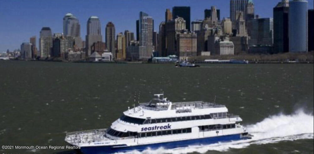 17 Via Ripa Way Sea Bright, NJ 07760 - Photo 33 of 33 a view of a lake with tall buildings
