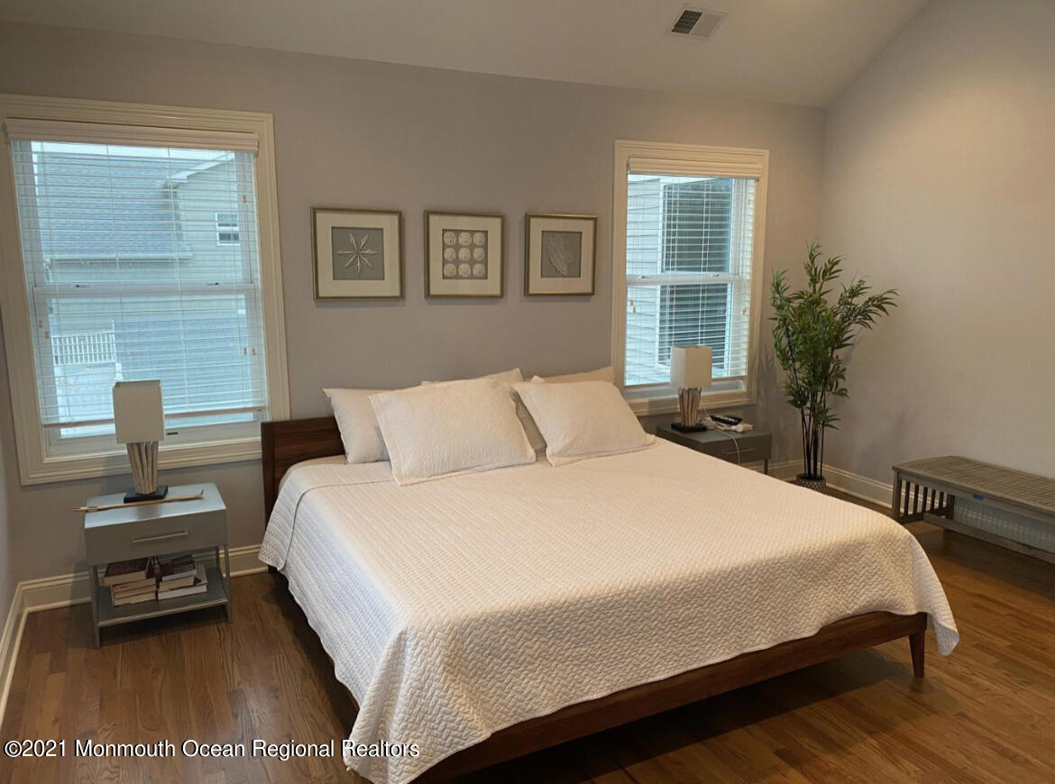 17 Via Ripa Way Sea Bright, NJ 07760 - Photo 6 of 33 a bedroom with a bed and a window