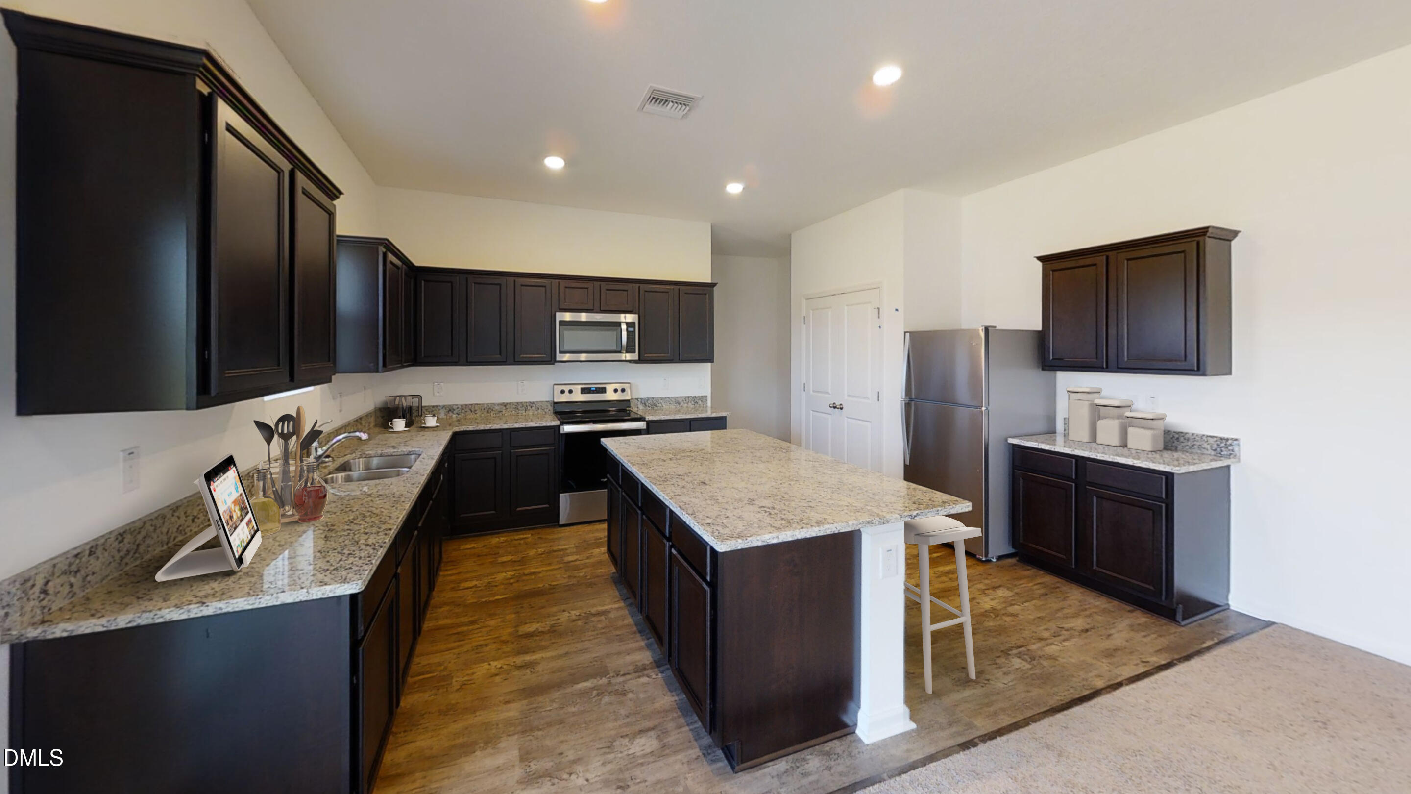 355 Shiloh Way Mebane, NC 27302 - Photo 4 of 10 a kitchen with kitchen island stainless steel appliances cabinets a sink and a counter top space