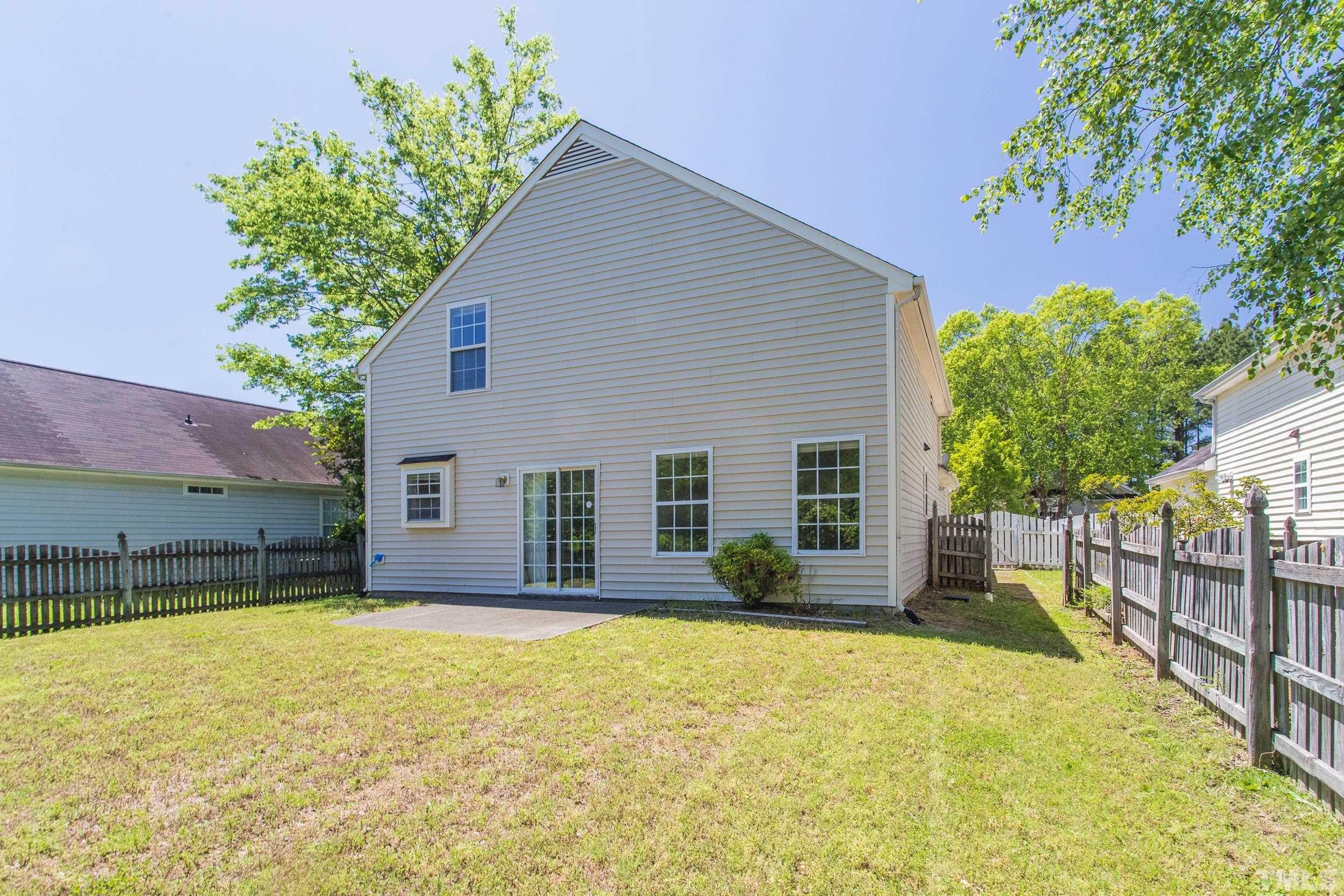 4411 Nightfall Court Durham, NC 27713 - Photo 26 of 28 a front view of a house with a yard and garage