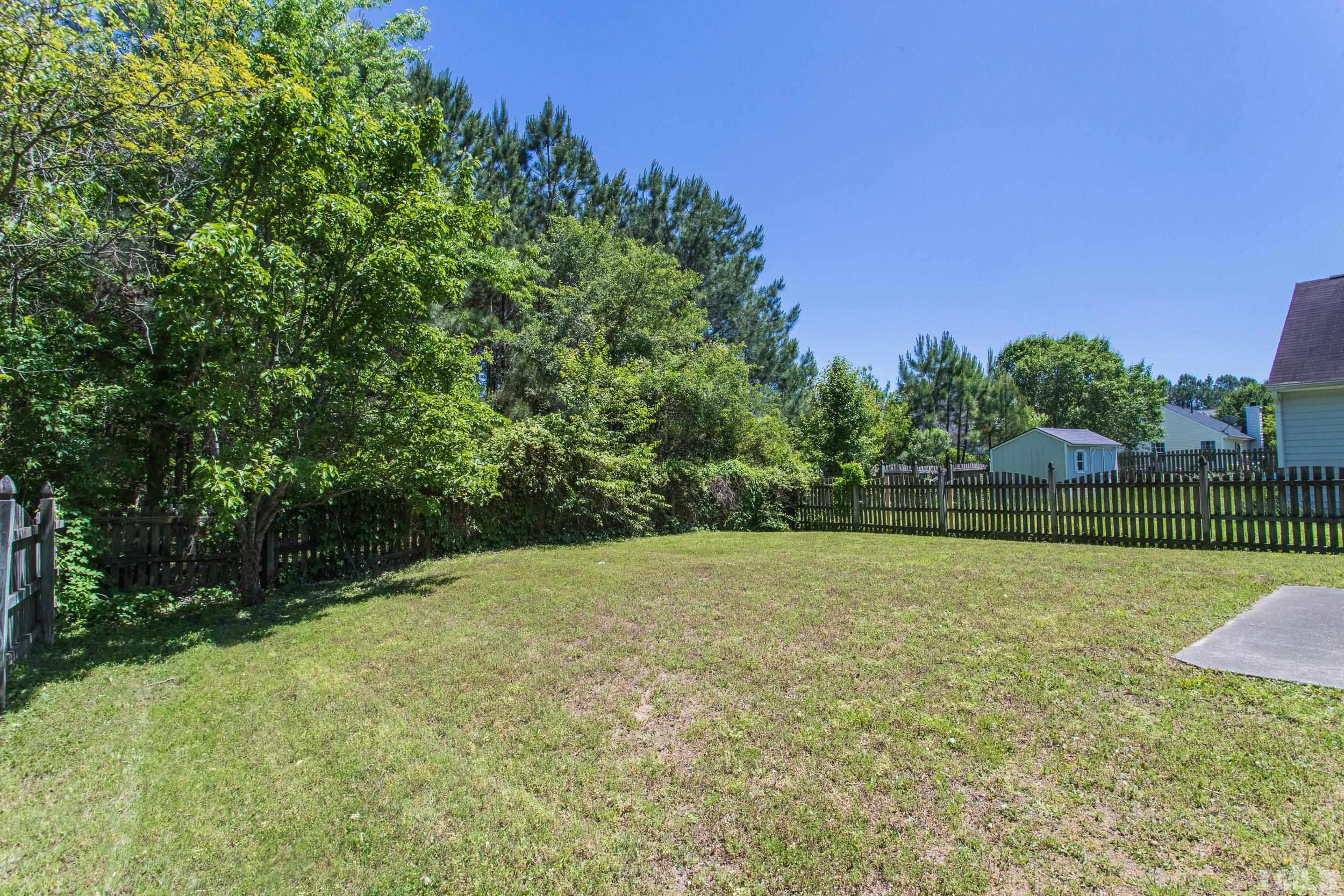 4411 Nightfall Court Durham, NC 27713 - Photo 27 of 28 a view of a field with trees in the background