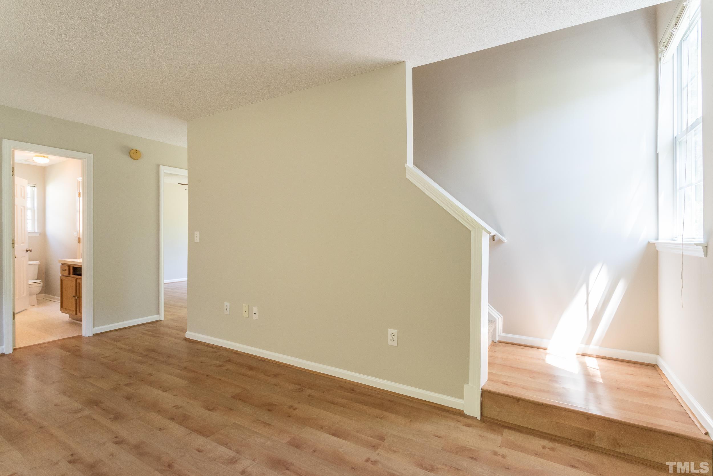 4411 Nightfall Court Durham, NC 27713 - Photo 5 of 28 a view of entryway with wooden floor