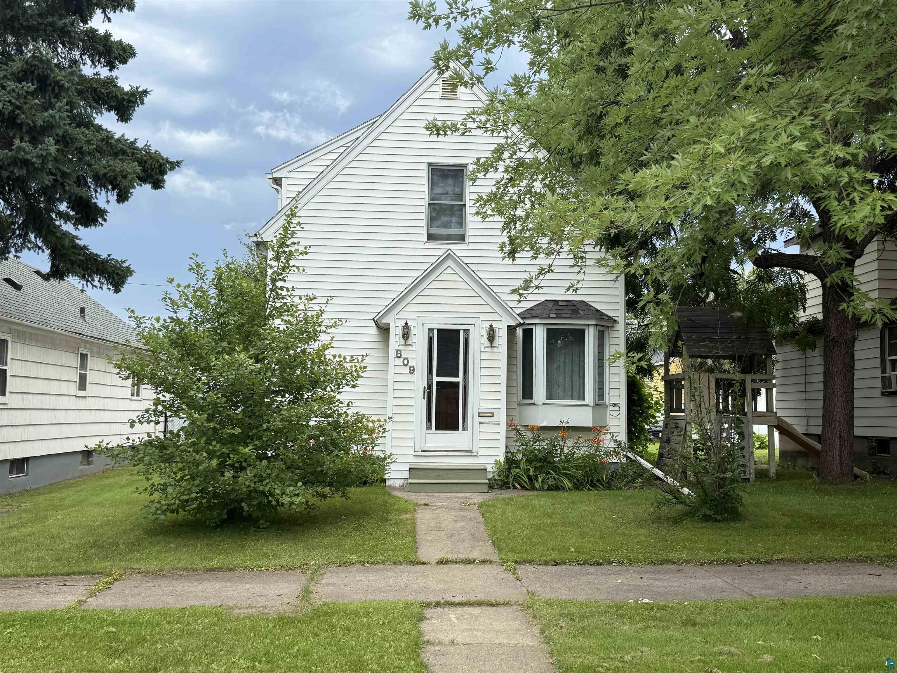 809 16th Street North Virginia, MN 55792 - Photo 1 of 44 View of front of property featuring a front lawn