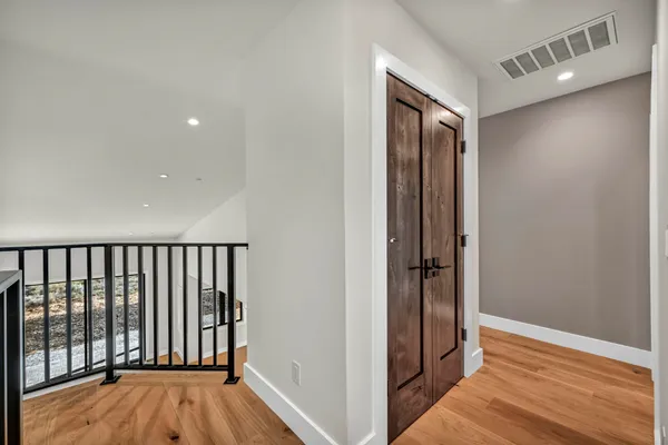 a view of an empty room with a ceiling fan