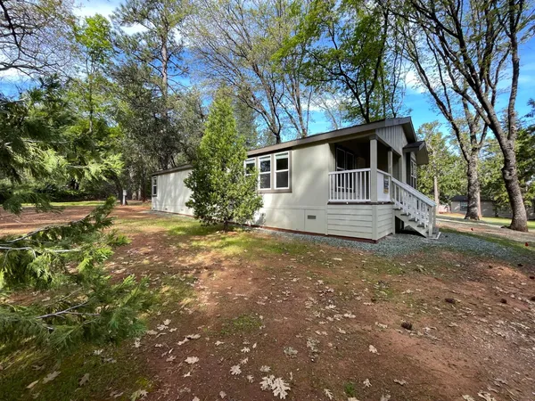 a house with trees in the background