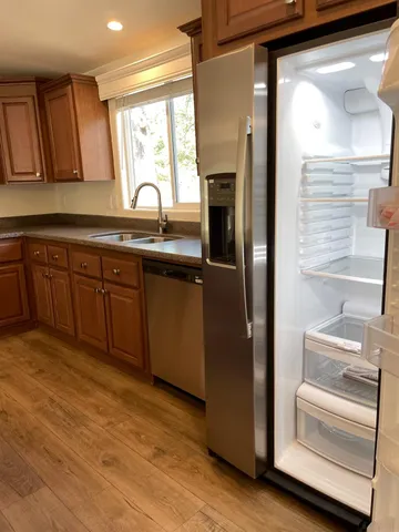 a kitchen with stainless steel appliances and cabinets