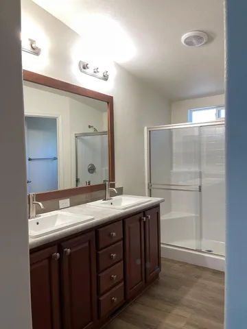 a view of a bathroom with a hardwood floor