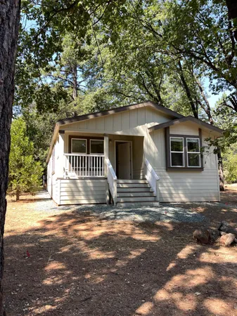 a house with trees in the background