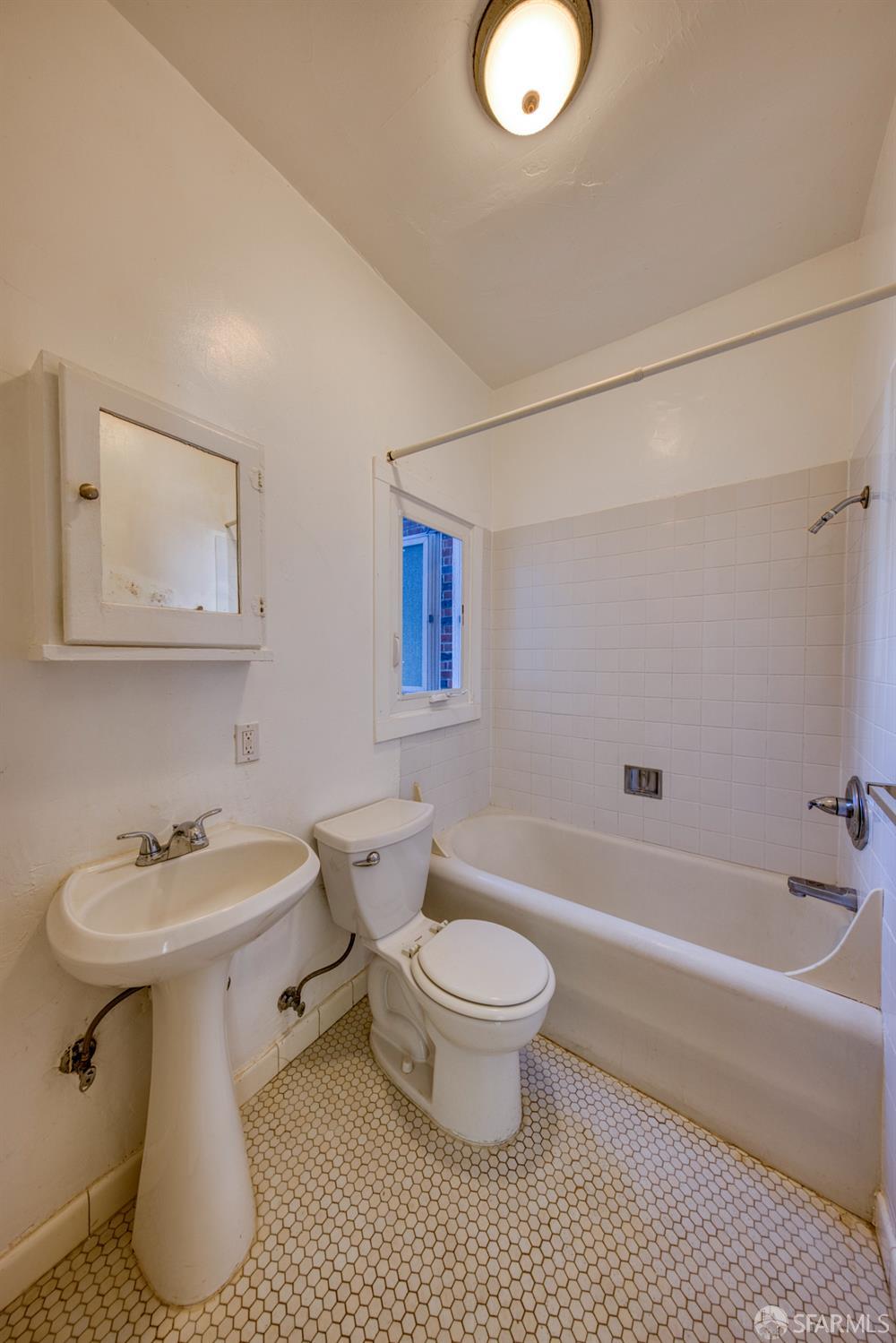 2451 Le Conte Avenue Berkeley, CA 94709 - Photo 19 of 36 a bathroom with a sink toilet and shower