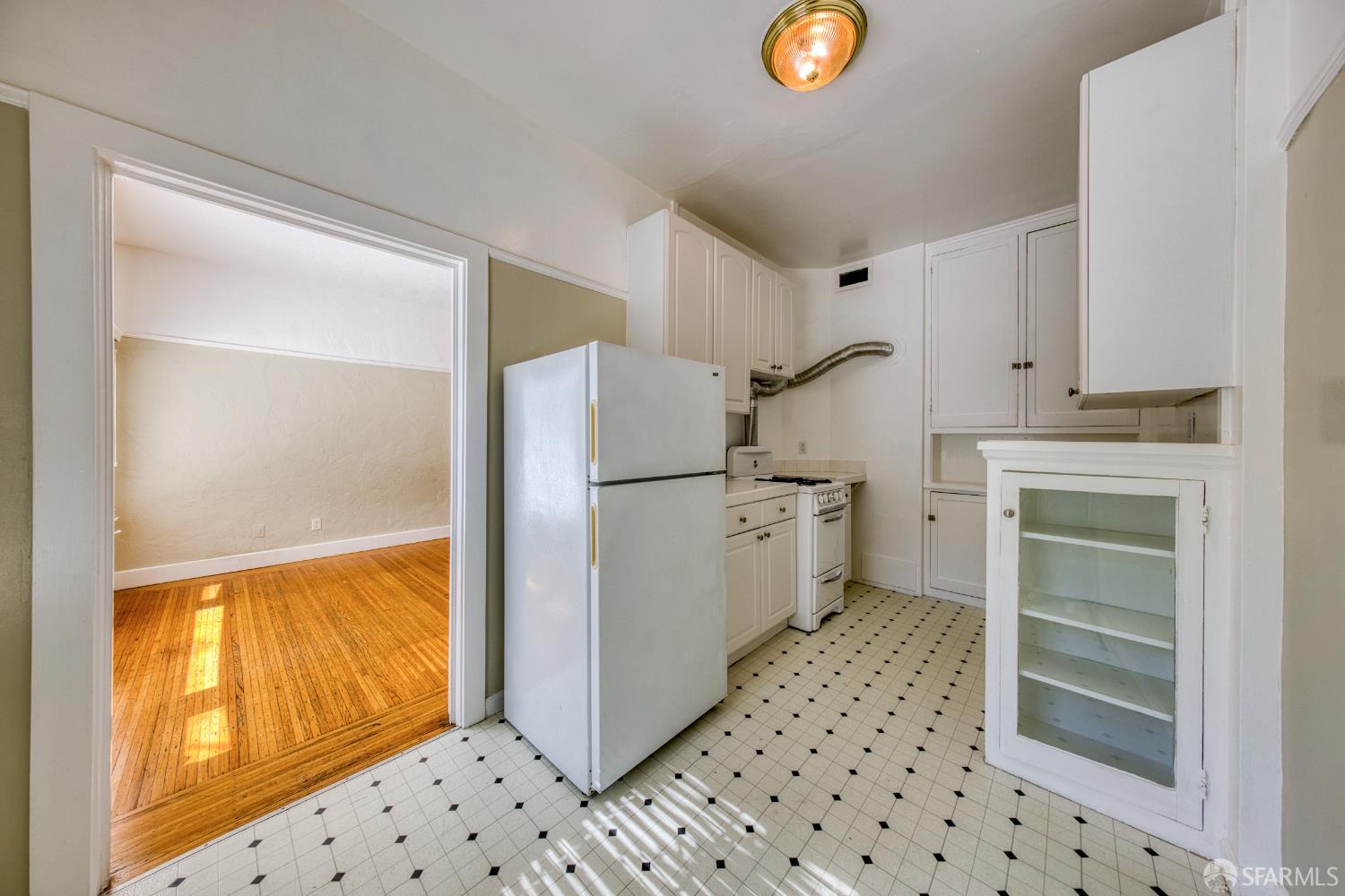 2451 Le Conte Avenue Berkeley, CA 94709 - Photo 20 of 36 a utility room with cabinets dryer and washer