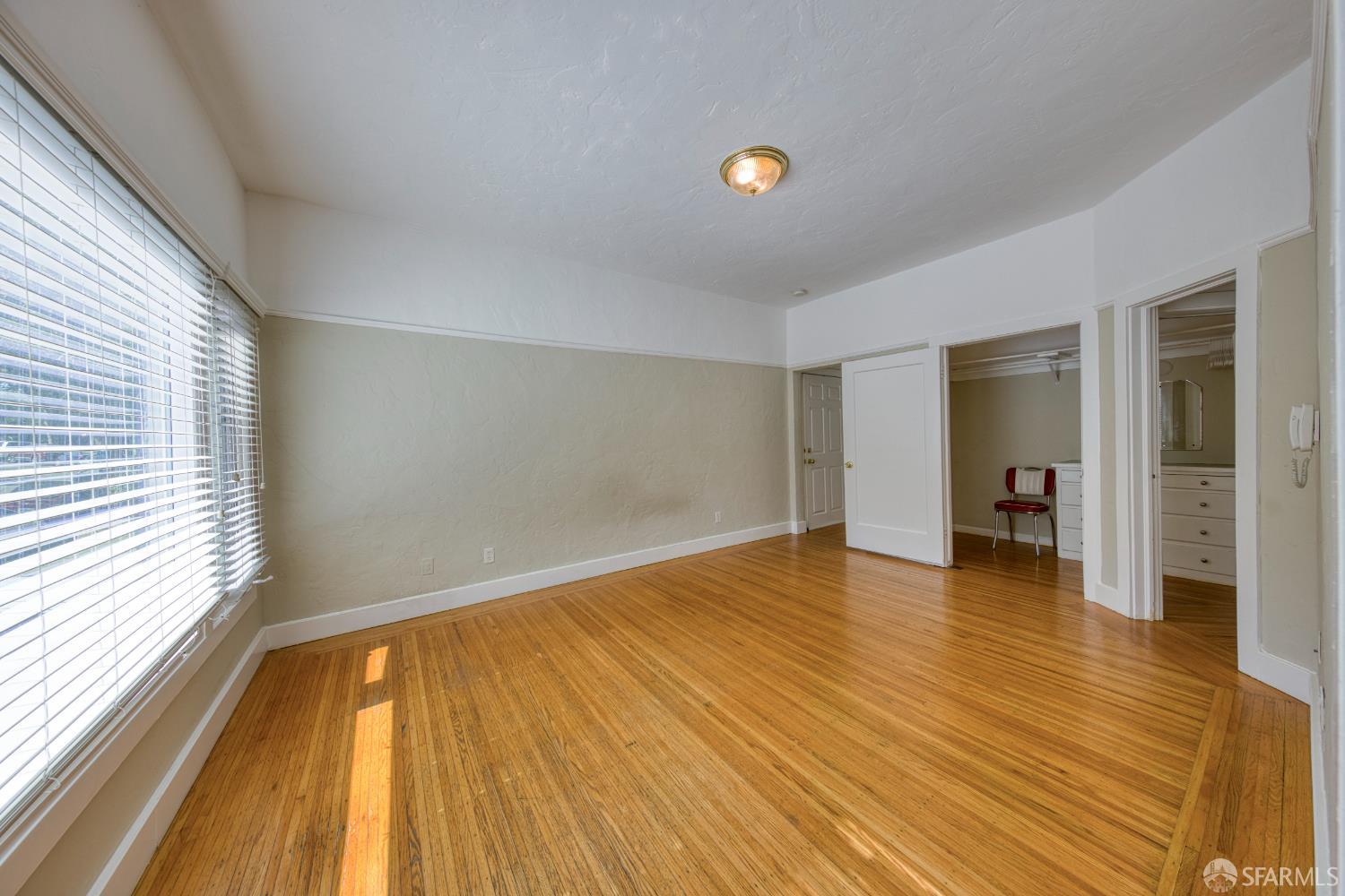 2451 Le Conte Avenue Berkeley, CA 94709 - Photo 21 of 36 a view of empty room with wooden floor and fan
