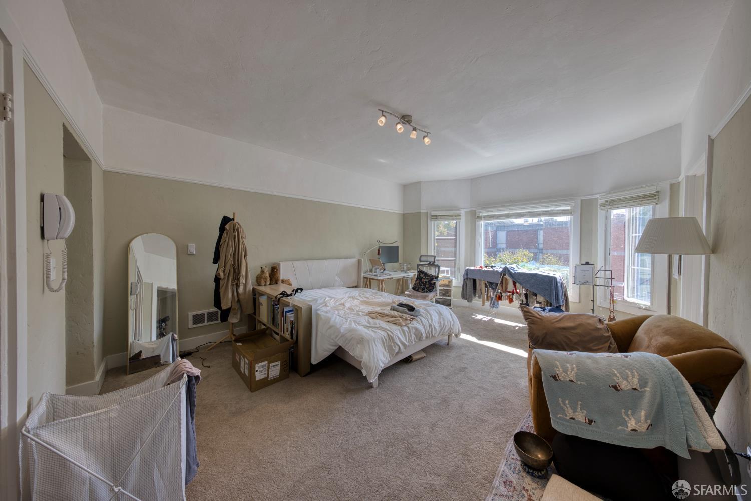 2451 Le Conte Avenue Berkeley, CA 94709 - Photo 23 of 36 a bed room with furniture and a chandelier