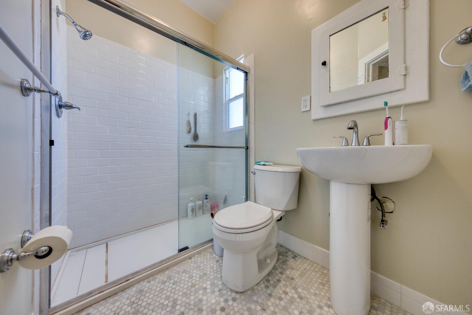 2451 Le Conte Avenue Berkeley, CA 94709 - Photo 24 of 36 a bathroom with a sink toilet and a mirror