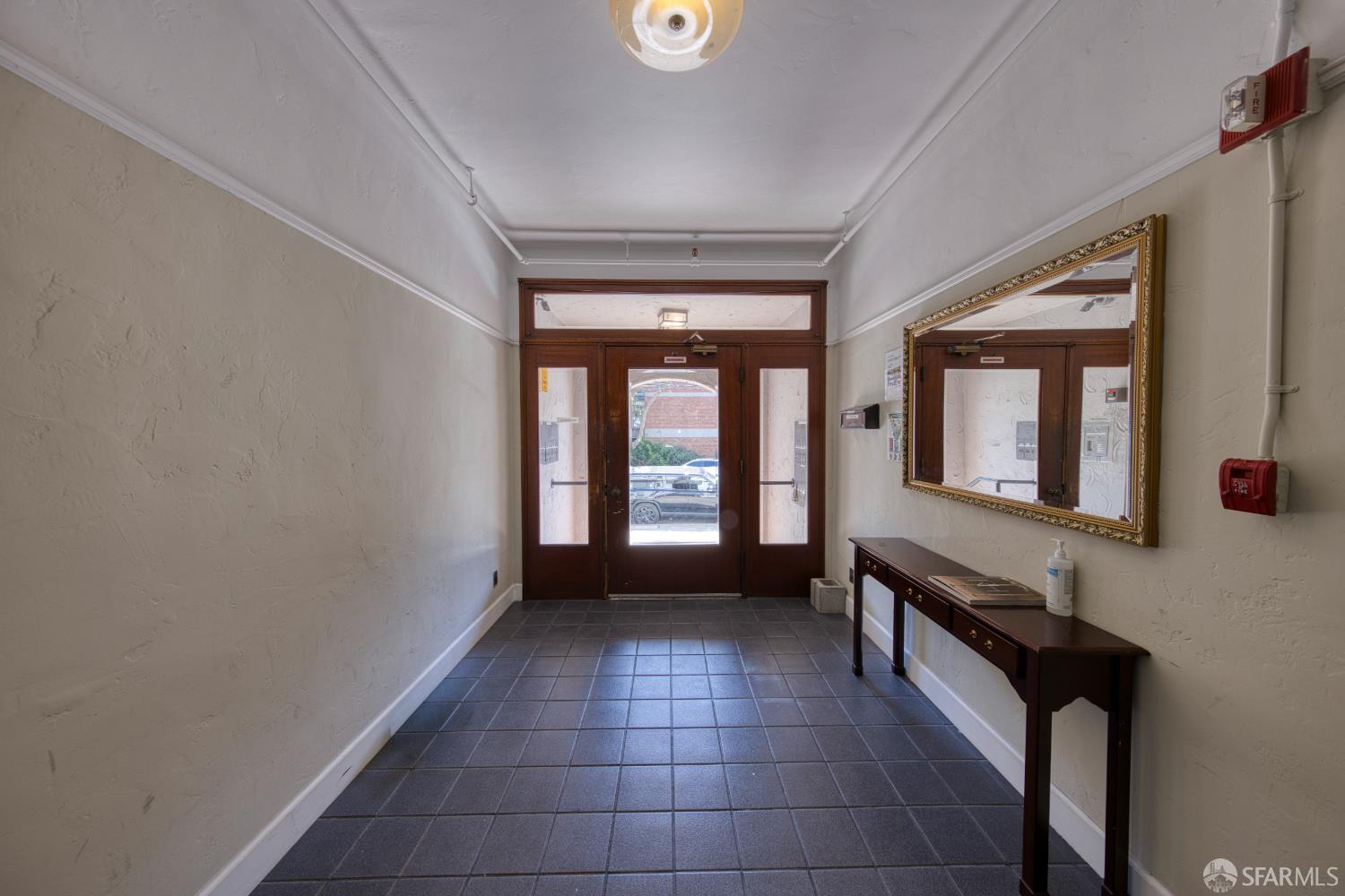 2451 Le Conte Avenue Berkeley, CA 94709 - Photo 30 of 36 a view of an empty room with a fireplace and a window