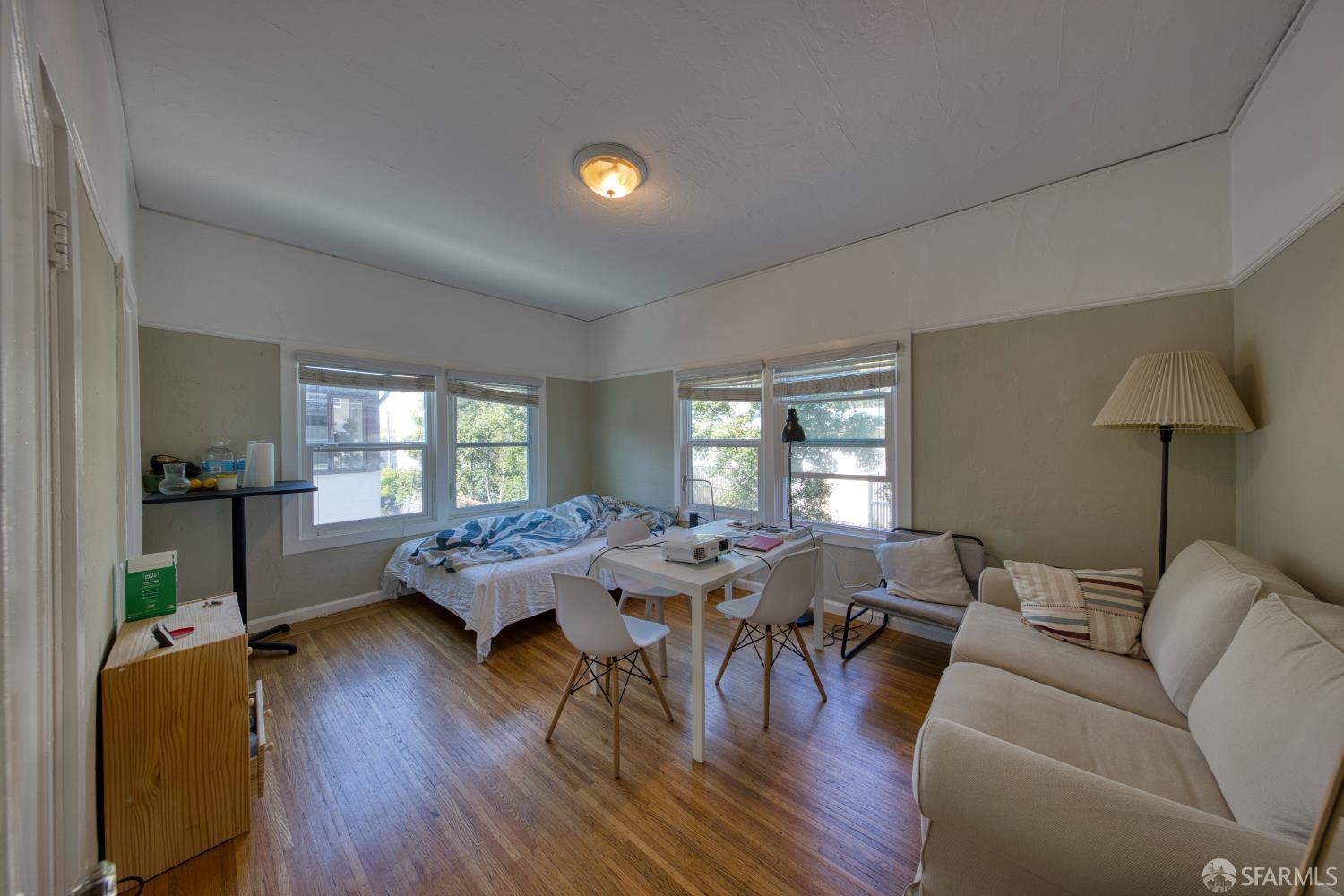 2451 Le Conte Avenue Berkeley, CA 94709 - Photo 31 of 36 a living room with furniture and wooden floor