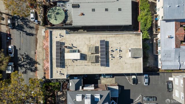 a front view of a residential apartment building with a yard