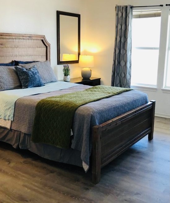 106 Coconut Road Surfside Beach, TX 77541 - Photo 17 of 25 a bedroom with a bed and window