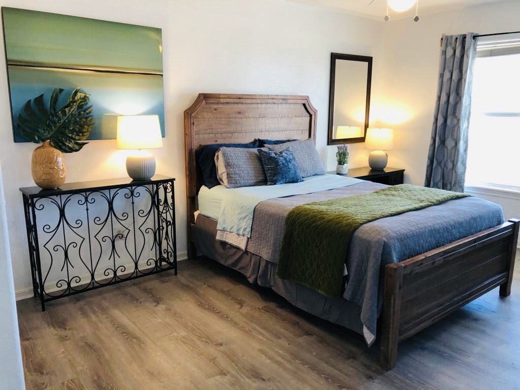 106 Coconut Road Surfside Beach, TX 77541 - Photo 18 of 25 a bedroom with a bed and window