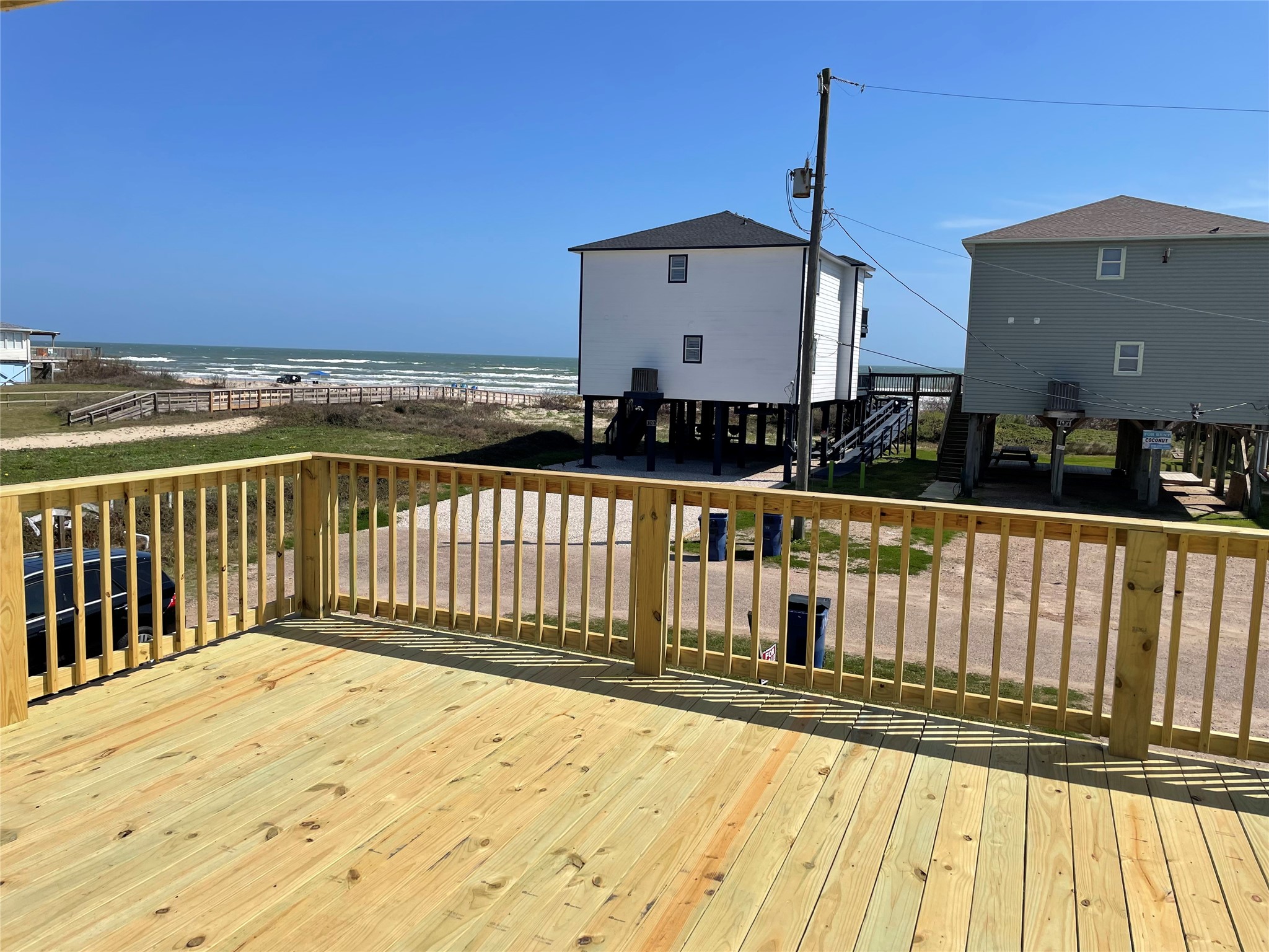 106 Coconut Road Surfside Beach, TX 77541 - Photo 5 of 25 a view of a brick house with wooden floor