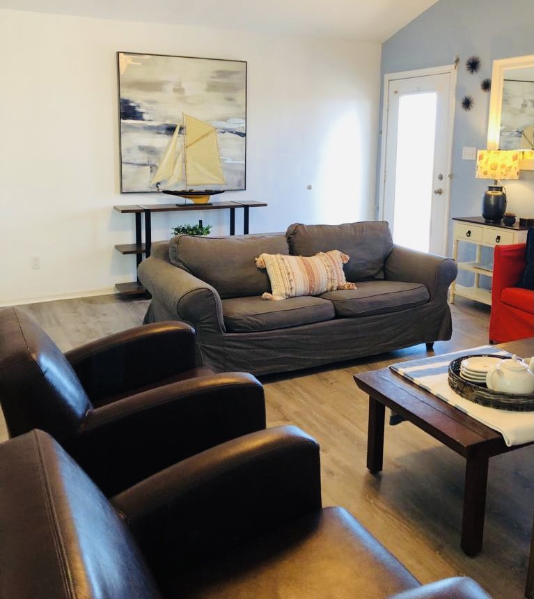 106 Coconut Road Surfside Beach, TX 77541 - Photo 8 of 25 a living room with furniture and painting on the wall